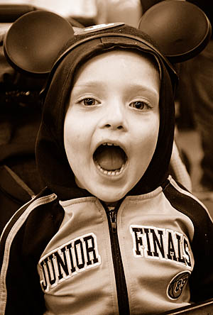 Malcolm, at Disney World, showing where he would keep his mouse, if he had a mouse.