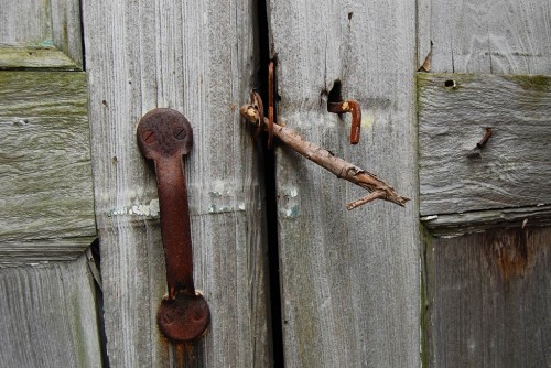 Stick is used to hold door closed