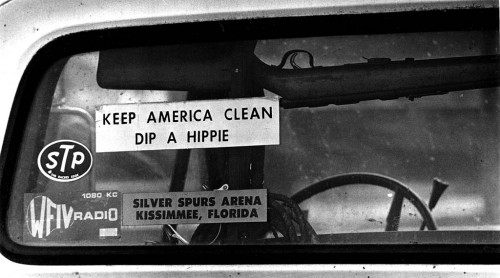 Dip a Hippy bumper sticker under pickup rifle rack