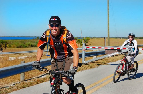 Chris and Lynn dodge gate on Lake Okeechobee Scenic Trail