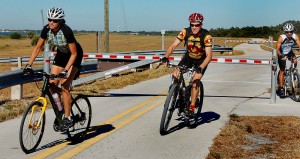 Pam, Per and Rick dodge gate on Lake Okeechobee Scenic Trail