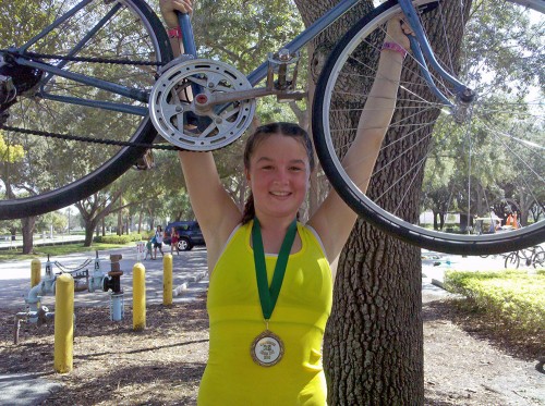 Valerie, 274, finished the Gardens Kids Tri on "Old Blue"